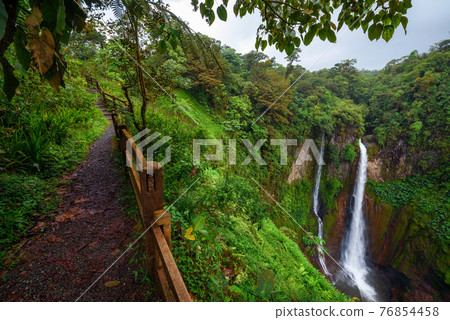 Catarata del Toro waterfall with footpath in Costa Rica Catarata del Toro waterfall with footpath in Costa Rica 76854458