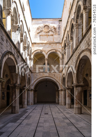 Stone arches decorate the Sponza palace inside the old town of Dubrovnik Croatia 76854518