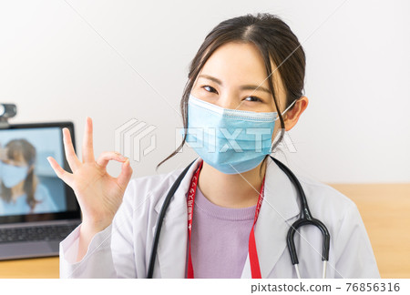 Young female doctor making an OK mark Young female doctor making an OK mark 76856316