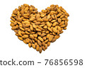 A heart made up of almonds. Subject on a white background. 76856598