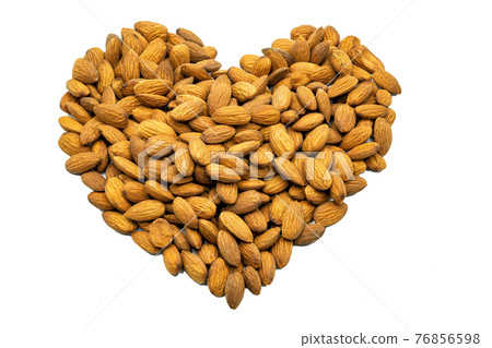 A heart made up of almonds. Subject on a white background. A heart made up of almonds. Subject on a white background. 76856598