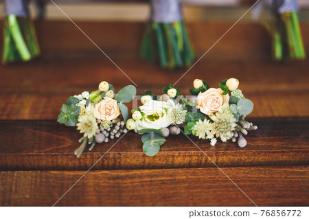 Beautiful wedding bouquet with different flowers, roses Beautiful wedding bouquet with different flowers, roses 76856772