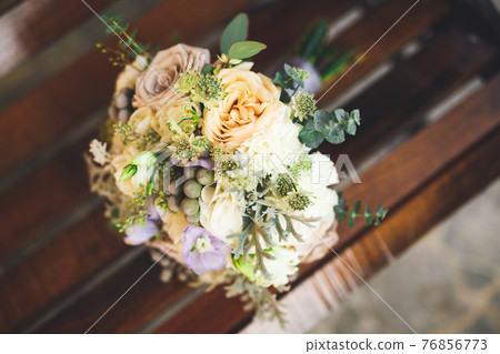 Wonderful luxury wedding bouquet of different flowers Wonderful luxury wedding bouquet of different flowers 76856773
