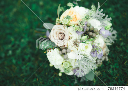Wonderful luxury wedding bouquet of different flowers Wonderful luxury wedding bouquet of different flowers 76856774