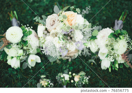 Beautiful wedding bouquet with different flowers, roses Beautiful wedding bouquet with different flowers, roses 76856775