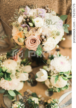 Beautiful wedding bouquet with different flowers, roses Beautiful wedding bouquet with different flowers, roses 76856776