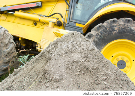 Tractor working in the field Tractor working in the field 76857269
