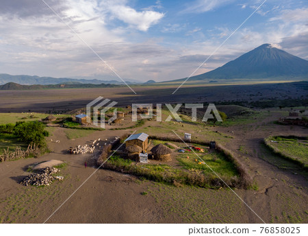 Aerial Drone Shot. Traditional Masai village at Sunset time near Arusha, Tanzania Aerial Drone Shot. Traditional Masai village at Sunset time near Arusha, Tanzania 76858025