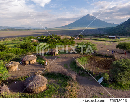 Aerial Drone Shot. Traditional Masai village at Sunset time near Arusha, Tanzania 76858028