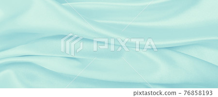 Smooth elegant blue silk or satin luxury cloth texture as abstract background. Luxurious background design 76858193