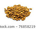A group of shelled almonds on a white background. Perfect shot for vegan living, health and wellness. 76858219
