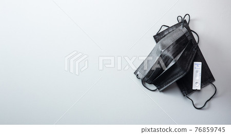 Covid-19 rapid antigen test. Rapid antibodies test kit and surgical face mask. Covid-19 rapid antigen test. Rapid antibodies test kit and surgical face mask. 76859745