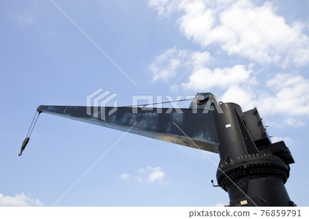 Black construction crane from below 76859791