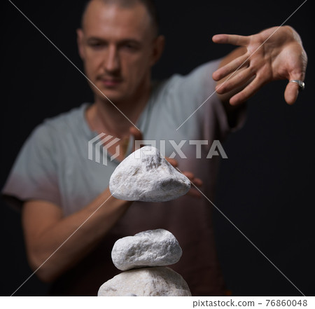 Man sitting on the floor in yoga pose studio shot Man sitting on the floor in yoga pose studio shot 76860048