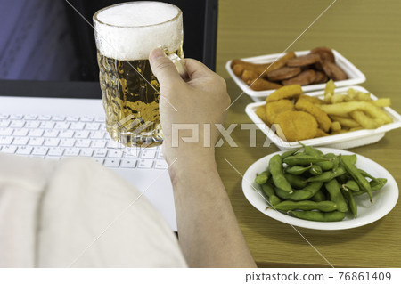 Image of a woman having an online drinking party at home using a laptop computer Image of a woman having an online drinking party at home using a laptop computer 76861409