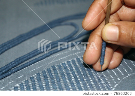 woman shoes design texture on cloth with hand needle for business 76863203