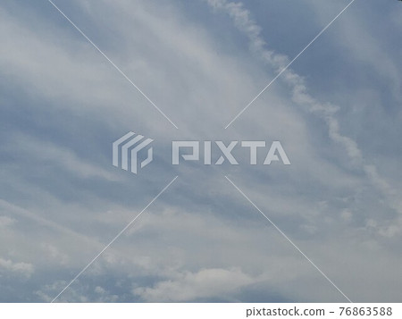 Contrails. The clear sky in early summer. Nature in Kyushu. 76863588