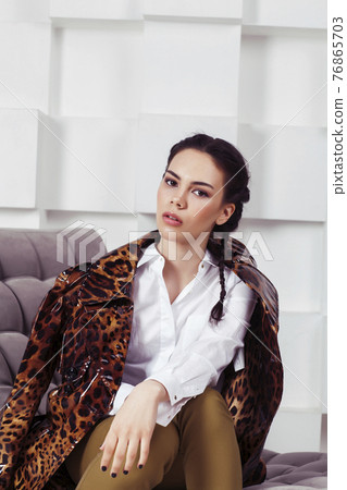 pretty stylish woman in fashion dress with in luxury rich room interior, lifestyle people concept, modern brunette 76865703