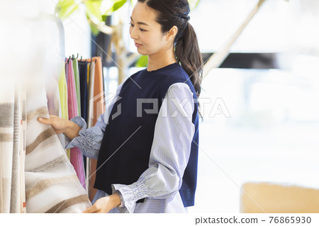 Woman choosing cloth 76865930