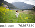 Spring rape blossoms, cherry blossoms and children 76867880