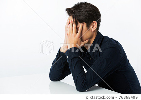 Men covering face 76868499