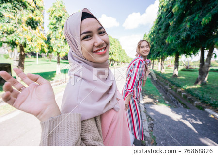 Two friends enjoying the summer sun Two friends enjoying the summer sun 76868826
