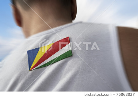 The national flag of Seychelles on the athlete's back The national flag of Seychelles on the athlete's back 76868827