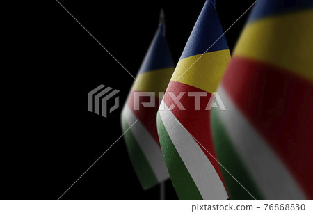 Small national flags of the Seychelles on a black background Small national flags of the Seychelles on a black background 76868830