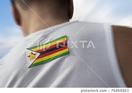 The national flag of Zimbabwe on the athlete's back The national flag of Zimbabwe on the athlete's back 76868863