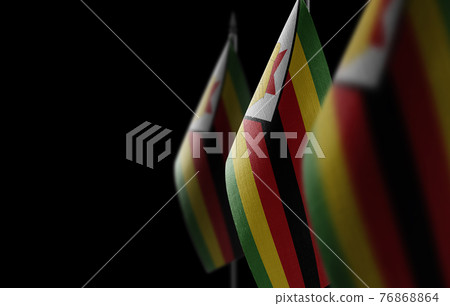 Small national flags of the Zimbabwe on a black background Small national flags of the Zimbabwe on a black background 76868864