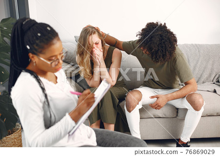 Casual couple man and woman having conversation with psychologist Casual couple man and woman having conversation with psychologist 76869029