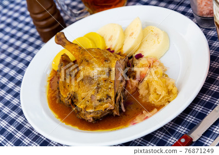 Roasted duck quarter with cabbage Roasted duck quarter with cabbage 76871249