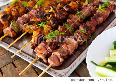 Grilled chicken and pork skewers Grilled chicken and pork skewers 76871250