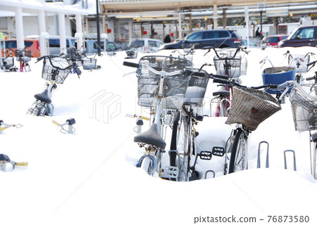 Bicycle parking lot in the snow 76873580