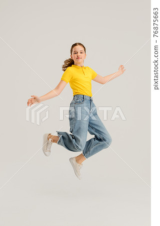 Caucasian girl isolated on white studio background. Copyspace. Childhood, education, emotions concept 76875663
