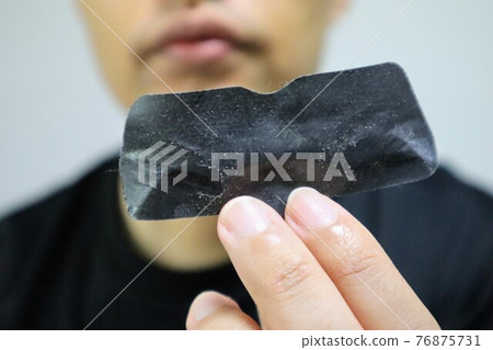 A person with a nose pack 76875731