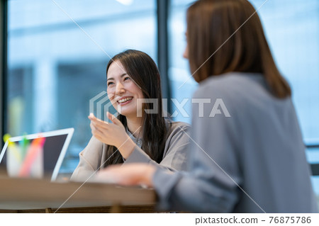 Business two women office desk work Business two women office desk work 76875786