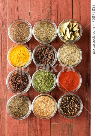 Various kinds of colourful seasonings in bowls. Collection of spices Various kinds of colourful seasonings in bowls. Collection of spices 76875852