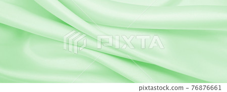 Smooth elegant green silk or satin luxury cloth texture as abstract background. Luxurious background design Smooth elegant green silk or satin luxury cloth texture as abstract background. Luxurious background design 76876661
