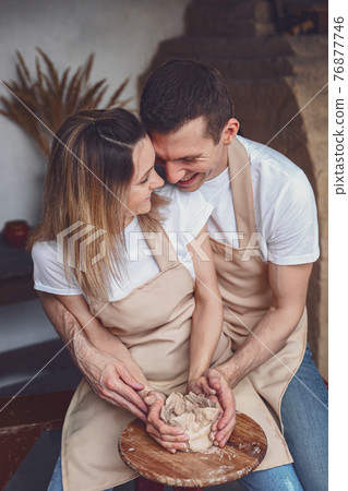 romantic couple in love working together on potter wheel and scu 76877746