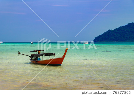 Thailand nature landscape. A long tail boat by the beach in Thailand Thailand nature landscape. A long tail boat by the beach in Thailand 76877805