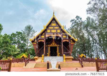Ubosot (ordination hall) made from teakwood in Tesdhammanava temple. Ubosot (ordination hall) made from teakwood in Tesdhammanava temple. 76877815