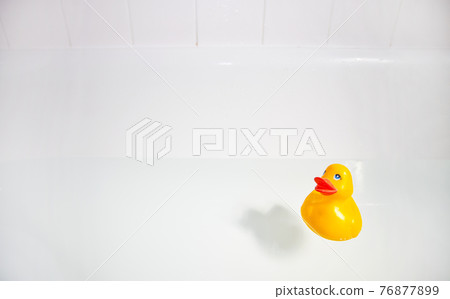 Rubber duck in bathtub 76877899
