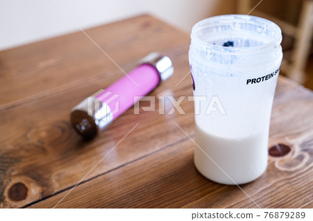 Protein drinks and dumbbells Protein drinks and dumbbells 76879289