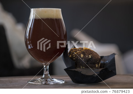 Full beer glass with cherry ale 76879423