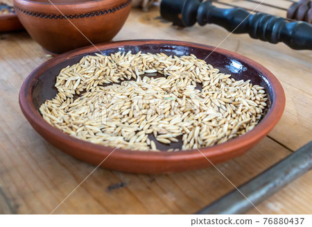 rye, dried seeds in earthenware for bread making rye, dried seeds in earthenware for bread making 76880437