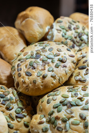 hamburger buns fresh and flavorful with sunflower seeds close-up hamburger buns fresh and flavorful with sunflower seeds close-up 76880438
