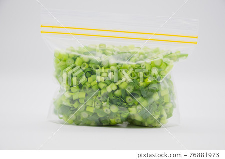 Green onions stored in a freezer bag 76881973
