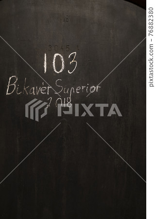 wine cellars with barrels, traditional wine called Bikaver near Eger, Hungary 76882380