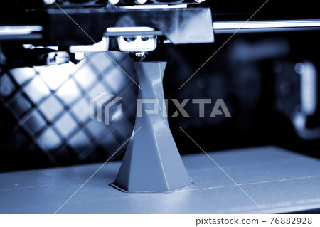 3D printer printing isolated volume triangular object blue gray color 3D printer printing isolated volume triangular object blue gray color 76882928